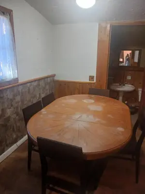 a wooden table in a room with chairs around it at Cabin 33, 3 bedroom 2 bath in Big Bear Lake