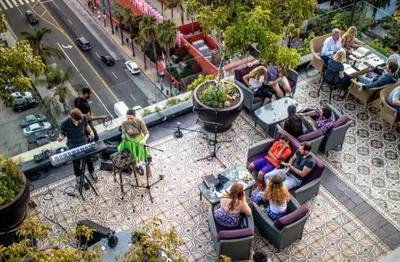a group of people sitting in chairs on a patio at 5 Star Private House 5 rooms in Los Angeles