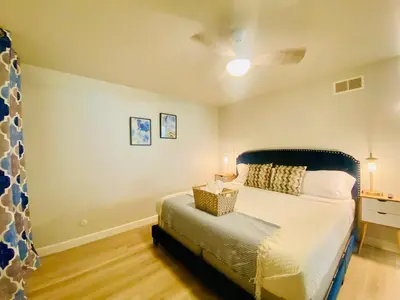 a bedroom with a bed and a ceiling fan at Cheerful 4 bed, 2 bath with pool near Disneyland in Placentia