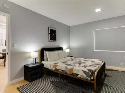 a bedroom with a bed and a table in it at Modern 4 bedroom in San Fernando in San Fernando