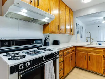 a kitchen with a stove and a sink at Modern 4 bedroom in San Fernando in San Fernando