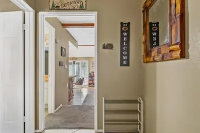 a hallway of a home with a stairwell at BIg Bear G5 Getaway in Big Bear Lake