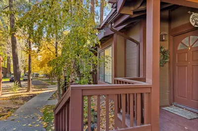 a porch of a home with a wooden door at BIg Bear G5 Getaway in Big Bear Lake