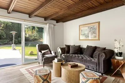 a living room with a couch and two chairs at Adorable 4 bedroom home with Pool & more in Los Angeles
