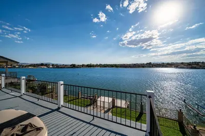 a balcony with a view of a lake at The Lakefront Oasis in Victorville