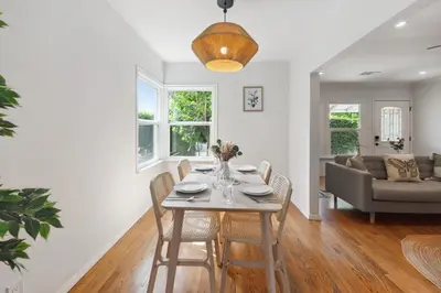 a dining room and living room with a table and chairs at Cosy 3BD by Santa Monica - Beach & Airport 10 min away in Los Angeles