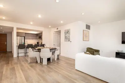 a living room with a couch and a table at Exquisite Haven with Patio Sleeps 4 in Los Angeles