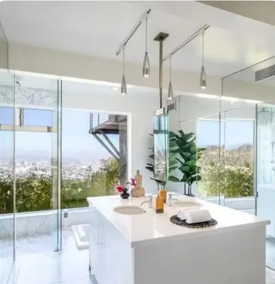 a bathroom with a sink and a mirror at Secluded Luxury Hollywood Hills Retreat in Los Angeles