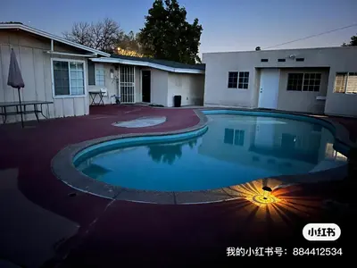 a swimming pool in front of a house at \u6e29\u99a8\u7684\u5c0f\u623f\u95f4 in West Covina