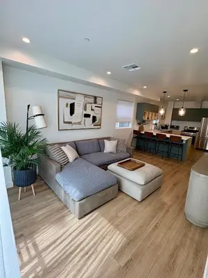 a living room with a couch and a table at New Luxe 3B 3Bath Townhouse in Sherman Oaks
