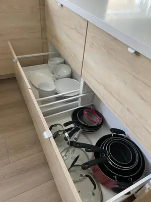 a cupboard filled with pots and pans and plates at New Luxe 3B 3Bath Townhouse in Sherman Oaks