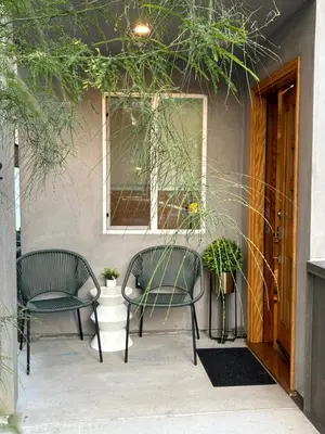 two chairs and a window on a patio at New Luxe 3B 3Bath Townhouse in Sherman Oaks