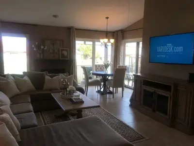 a living room with a couch and a tv at Beautiful Mountain Home in Tehachapi