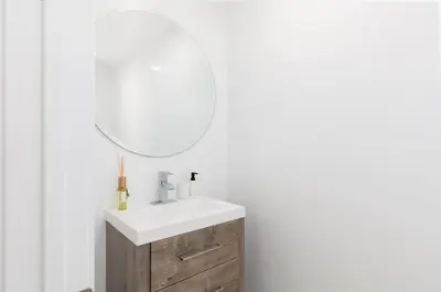 a bathroom with a white sink and a mirror at 3 bedroom near Culver City-Palms in Los Angeles