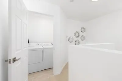 a white kitchen with a counter and a dishwasher at 3 bedroom near Culver City-Palms in Los Angeles