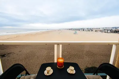 a view of the beach from the balcony of a beach house at Oceanfront Studio with balcony in Redondo Beach