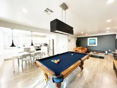 a living room with a pool table and a kitchen at Relax and Play, 2BR Close to SoFi, LAX - SH1-LAD in Los Angeles