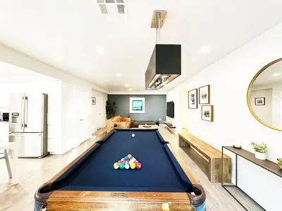 a pool table in the middle of a living room at Relax and Play, 2BR Close to SoFi, LAX - SH1-LAD in Los Angeles