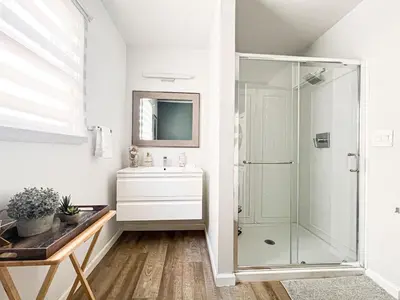 a white bathroom with a shower and a sink at Relax and Play, 2BR Close to SoFi, LAX - SH1-LAD in Los Angeles