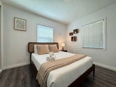 a bedroom with a bed with two stuffed animals on it at Charming 2BR Spot Near LAX, SoFi and Forum - MK1-LAD in Los Angeles
