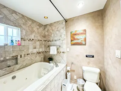 a bathroom with a tub and a toilet and a sink at Charming 2BR Spot Near LAX, SoFi and Forum - MK1-LAD in Los Angeles