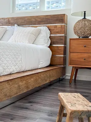 a bedroom with a wooden bed and a wooden stool at Perfect 1-BR Spot Near LAX, SoFi and Forum - MK2-LAD in Los Angeles