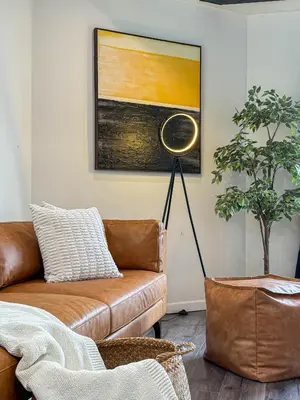 a living room with a brown couch and a painting at Perfect 1-BR Spot Near LAX, SoFi and Forum - MK2-LAD in Los Angeles