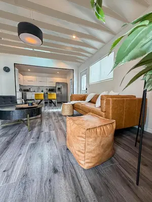 a living room with a couch and a table at Perfect 1-BR Spot Near LAX, SoFi and Forum - MK2-LAD in Los Angeles