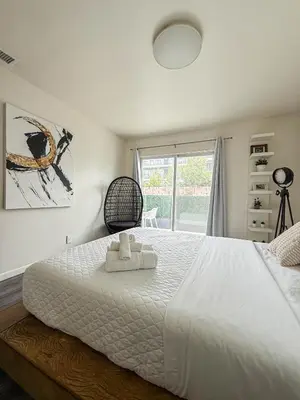 a bedroom with a large white bed with a window at Perfect 1-BR Spot Near LAX, SoFi and Forum - MK2-LAD in Los Angeles