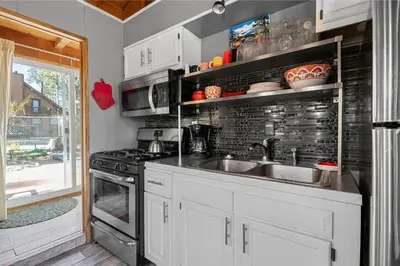 a kitchen with a sink and a stove at Casita de Sergio - Peek-A-Boo Lake View, Walk to Lake, Fireplace in Big Bear Lake