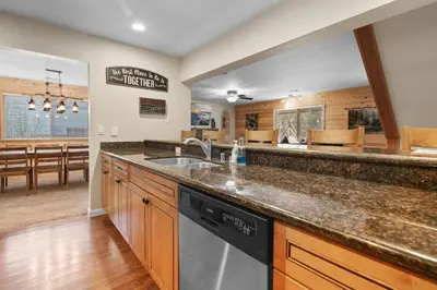 a kitchen with a sink and a dishwasher at Eagle Point Retreat - Sleeps 13 - 12 Adults Max, Game Room, Foosball, Fireplace, Deck, Barbecue in Big Bear Lake
