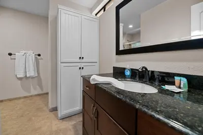 a bathroom with a sink and a mirror at Eagle Point Retreat - Sleeps 13 - 12 Adults Max, Game Room, Foosball, Fireplace, Deck, Barbecue in Big Bear Lake