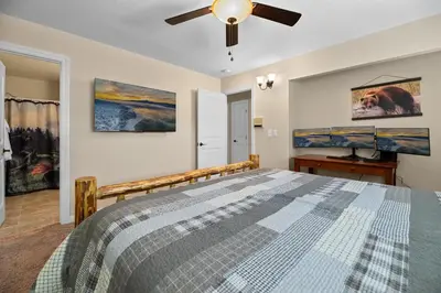 a bedroom with a bed and a ceiling fan at Eagle Point Retreat - Sleeps 13 - 12 Adults Max, Game Room, Foosball, Fireplace, Deck, Barbecue in Big Bear Lake