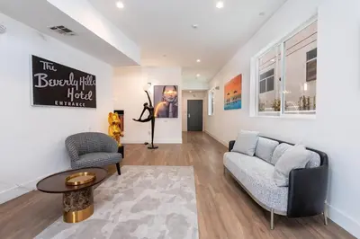 a living room with a couch and a table at Luxury 2BR Stay Balcony Views and Free Parking in Los Angeles