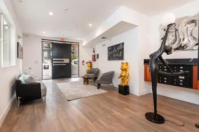 a living room with a statue of a woman at Modern and Chic 2BR Gem with Luxe Finishes, Parking in Los Angeles