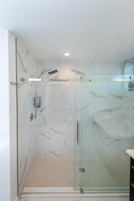 a bathroom with a shower with a glass door at Modern and Chic 2BR Gem with Luxe Finishes, Parking in Los Angeles