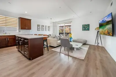 a living room with a kitchen and a dining room at Experience Lavish LA Living Sleek 2BR with Parking in Los Angeles