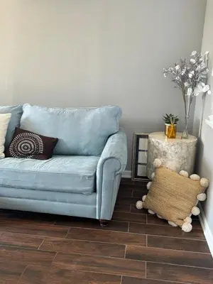 a blue couch in a living room with a floor at Hollywood escape in Los Angeles