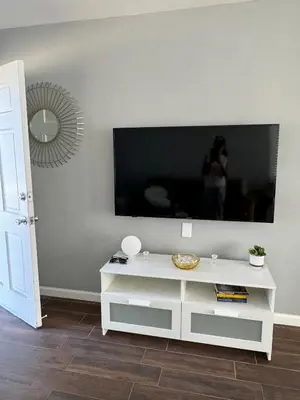 a white entertainment center with a tv on a wall at Hollywood escape in Los Angeles