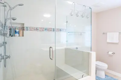 a bathroom with a glass shower with a toilet at Luxurious Villa in Diamond Bar- Private Cul-de-Sac in Diamond Bar