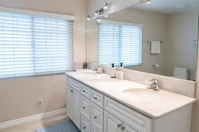 a bathroom with two sinks and a large mirror at Luxurious Villa in Diamond Bar- Private Cul-de-Sac in Diamond Bar