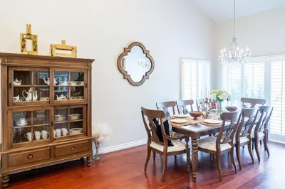 a dining room with a table and chairs and a chandelier at Luxurious Villa in Diamond Bar- Private Cul-de-Sac in Diamond Bar
