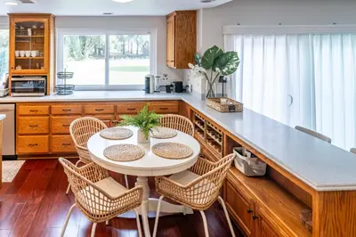 a kitchen with a white table and chairs at Luxurious Villa in Diamond Bar- Private Cul-de-Sac in Diamond Bar