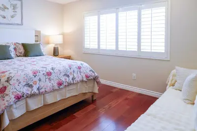 a bedroom with a bed and a window at Luxurious Villa in Diamond Bar- Private Cul-de-Sac in Diamond Bar