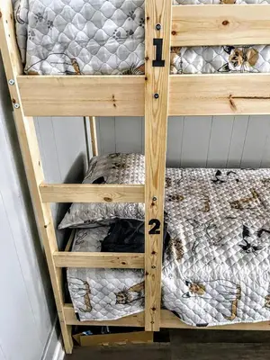 a wooden bunk bed with two bunk beds at Homes for Soul Los Angeles in Los Angeles