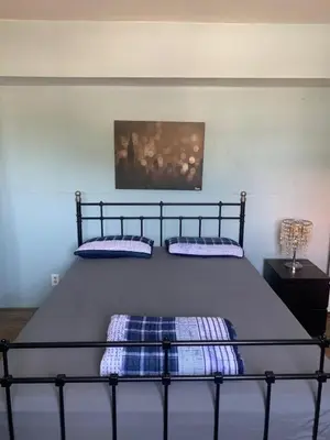 a bed with two pillows on it in a bedroom at Homes for Soul Los Angeles in Los Angeles
