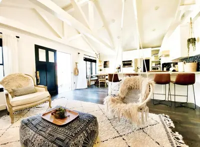 a living room with a couch and a table at Channel Islands Beach Retreat in Oxnard