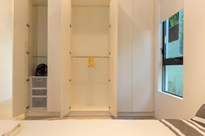 a room with white walls and a closet at Luxury suite with private entrance in Los Angeles