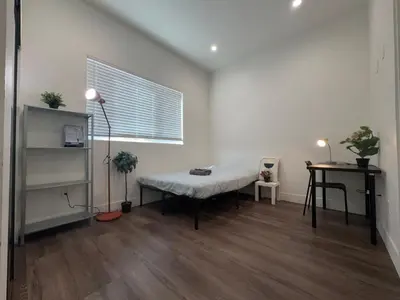 a living room with a bench and a window at Blue Stay Walk to BMO Stadium and USC in Los Angeles