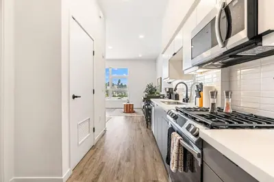 a kitchen with a stove and a sink at The Downtown Haven Suite, 1Mile to Dodger Stadium in Los Angeles